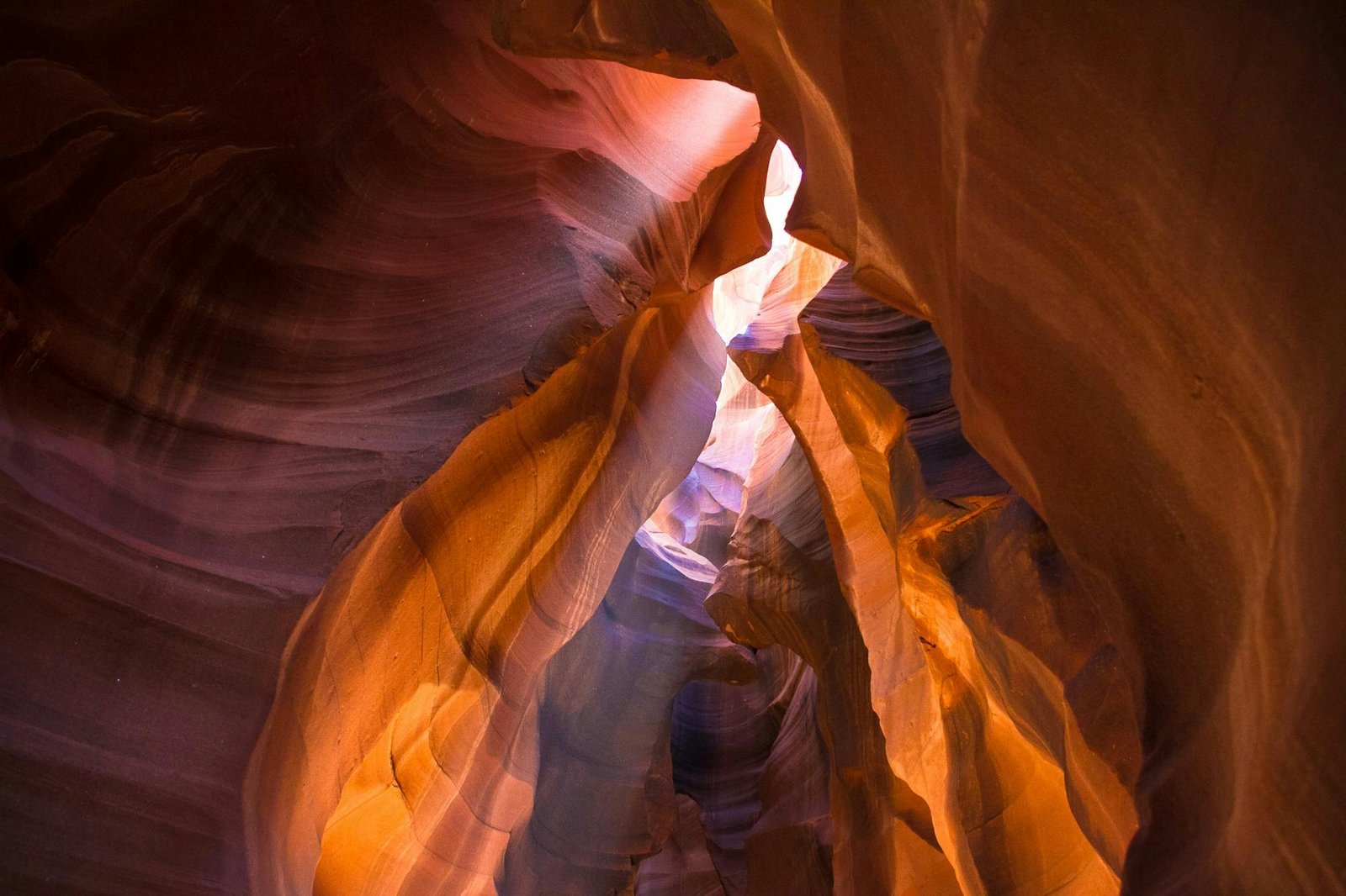Explore the stunning sandstone formations and vibrant colors of Antelope Canyon, Arizona, in this mesmerizing photo.